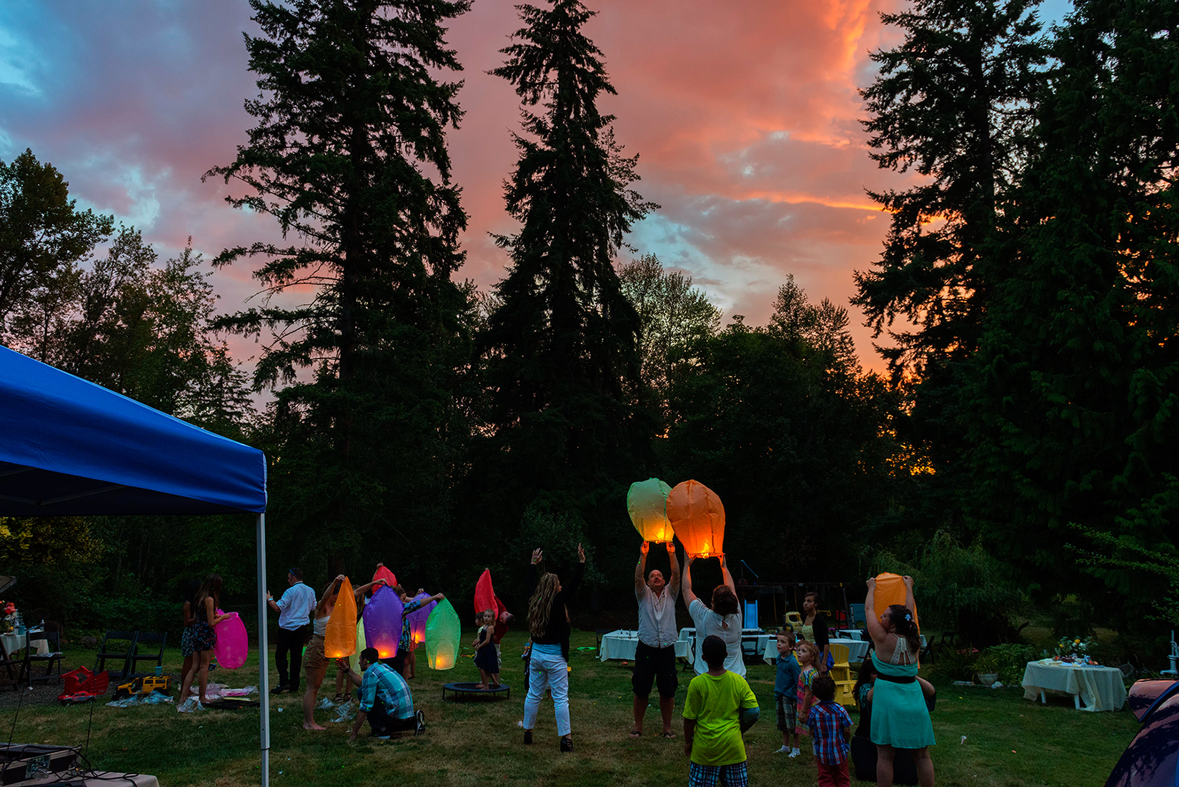 Wishing lanterns released backyard party